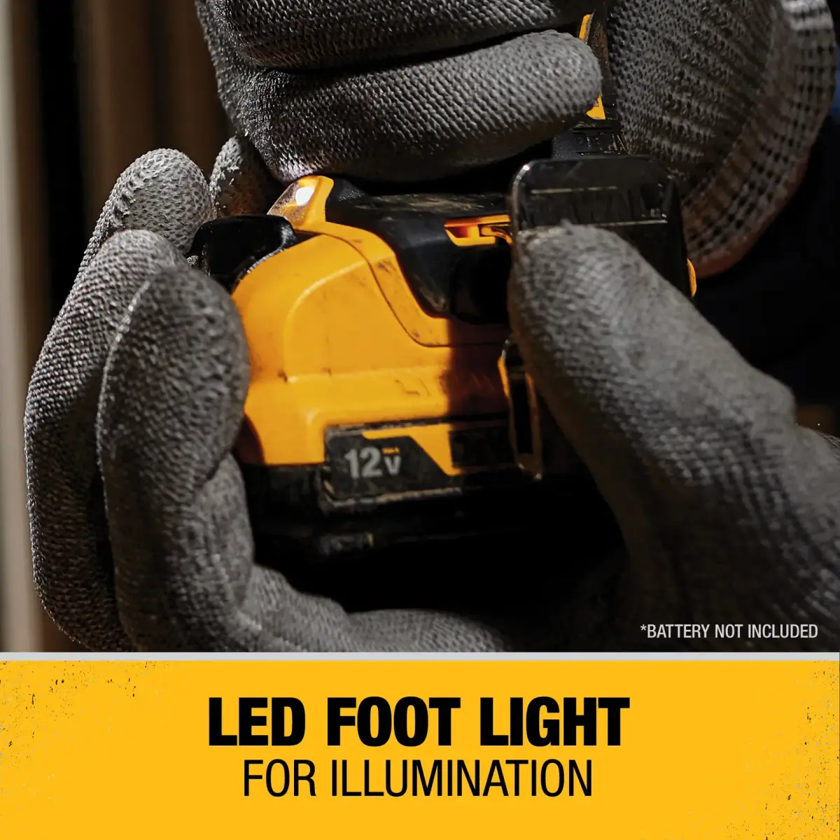 Gloved hands fitting a 12V battery pack into the DEWALT drill driver