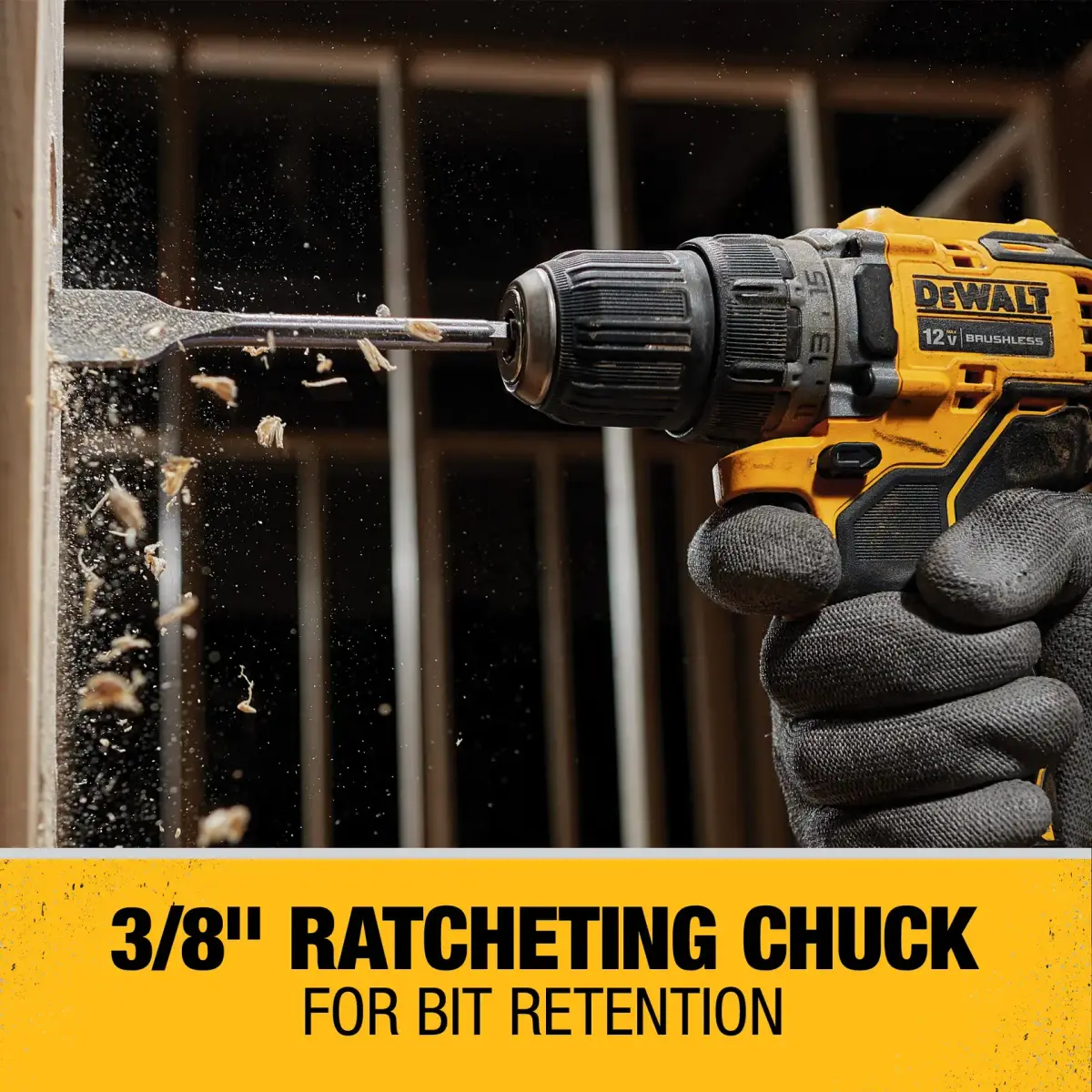 DEWALT 12V drill driver with a spade bit boring through a wall stud