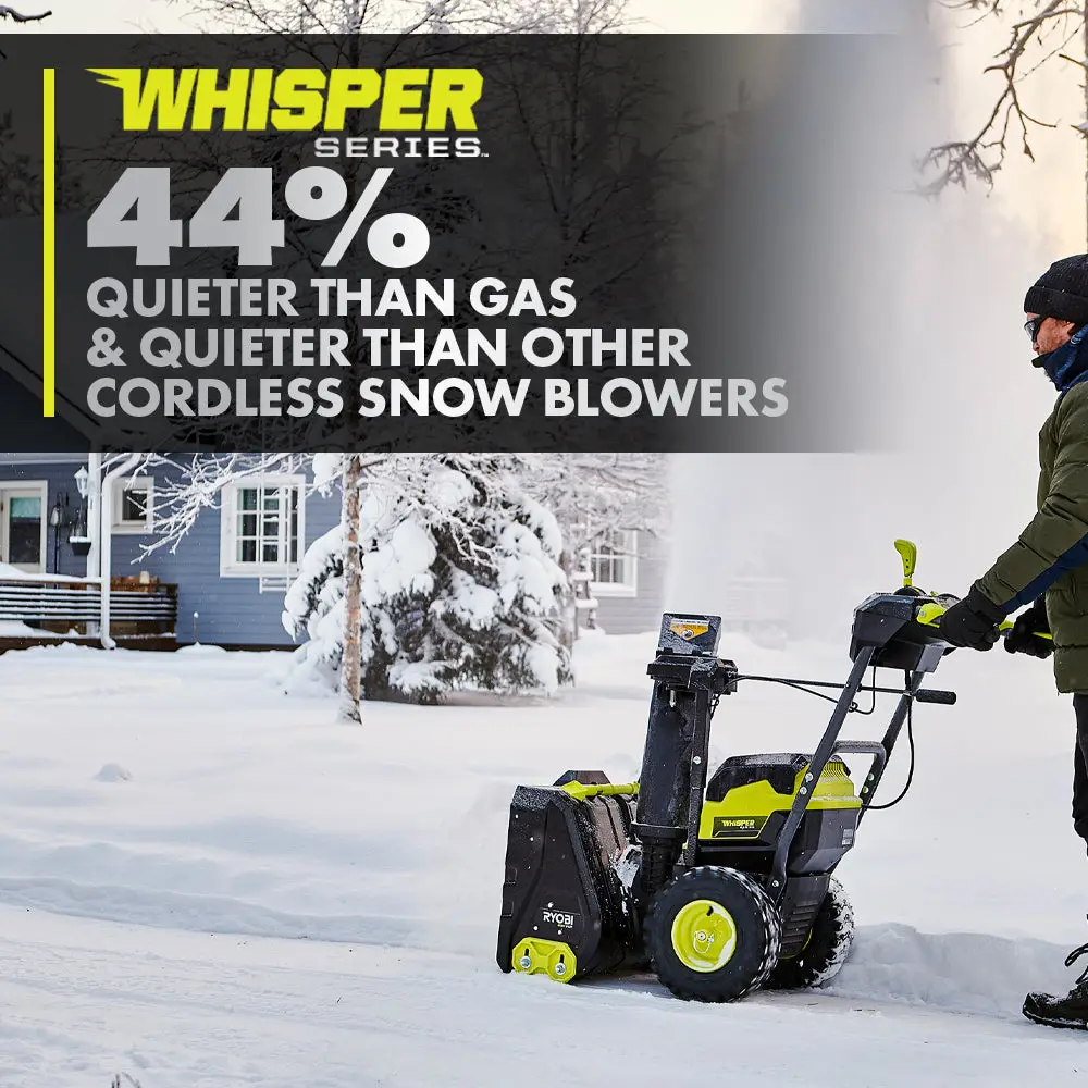 A person clearing a snowy driveway with a Ryobi two-stage snow blower