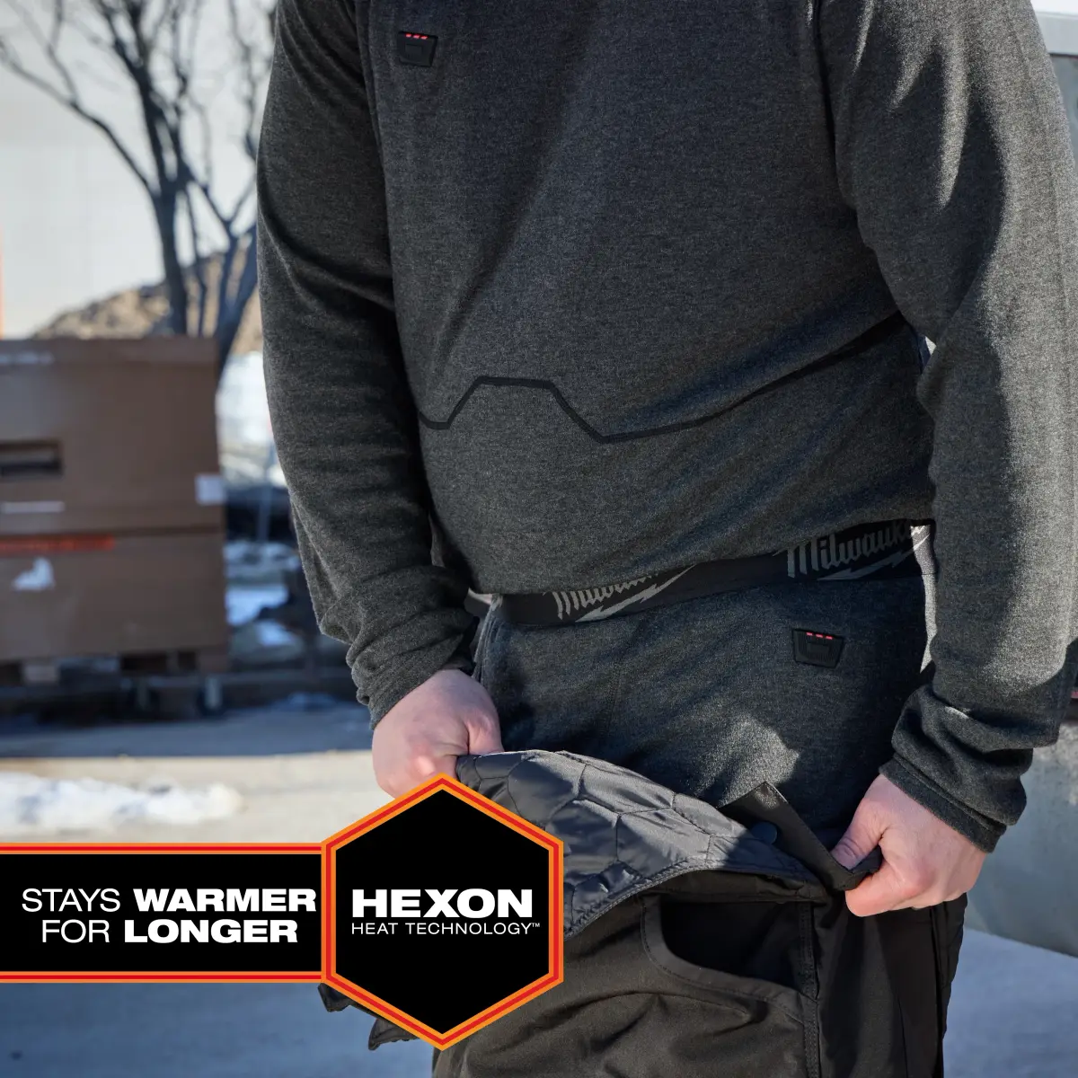 Heated merino baselayer worn under work pants on a winter jobsite