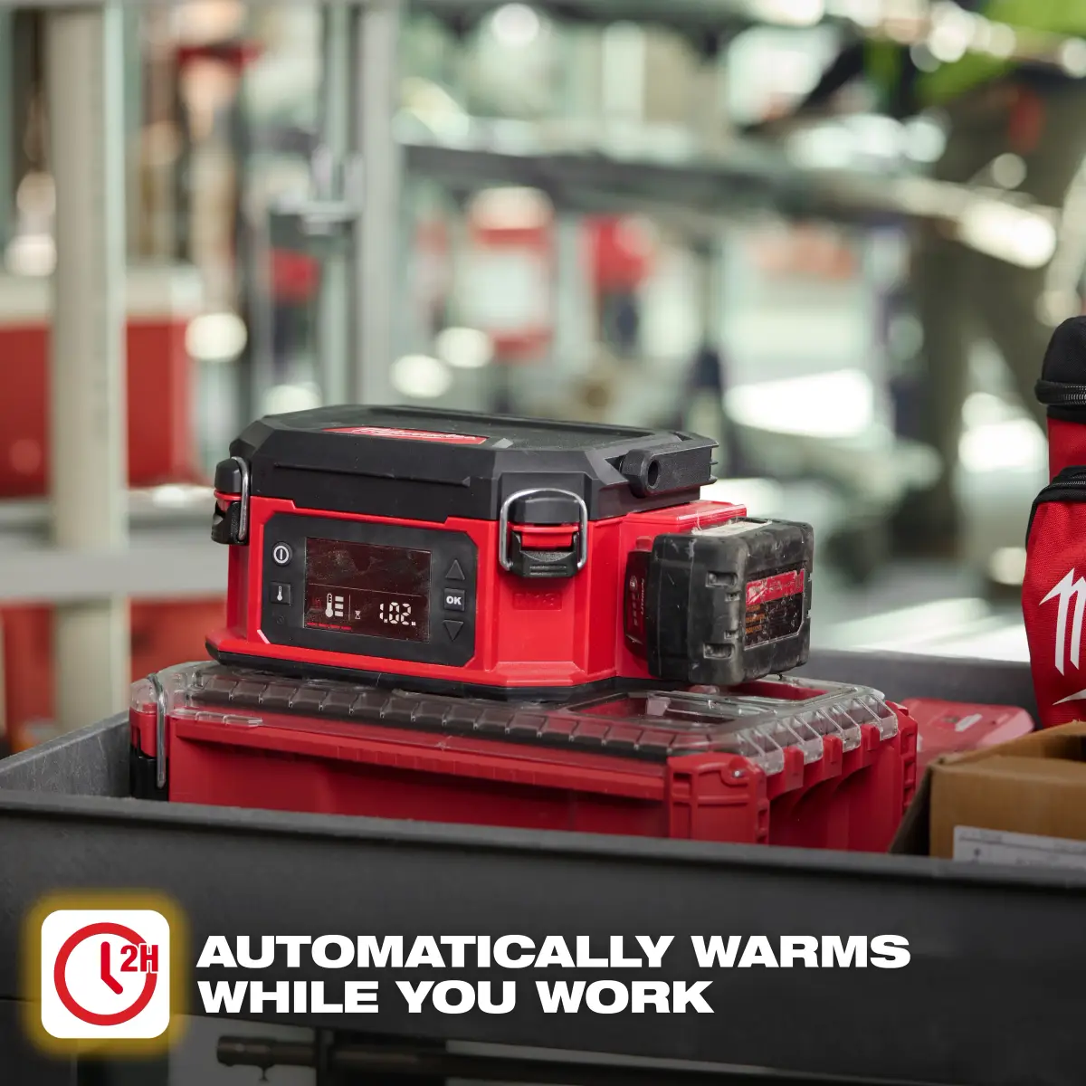 Milwaukee M18 Jobsite Lunch Warmer sitting on a PACKOUT stack on a job site